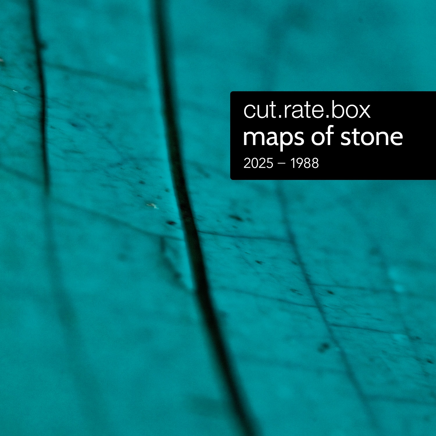 the cover of the Maps of Stone album, which is a close up photo of a cracked ceramic outdoor planter such that is looks like a map with a large main road and many minor roads branching off of it